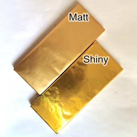Chocolate bar wrapped by shiny foil and matt foil